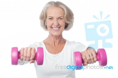 Happy Aged Woman Exercising Stock Photo