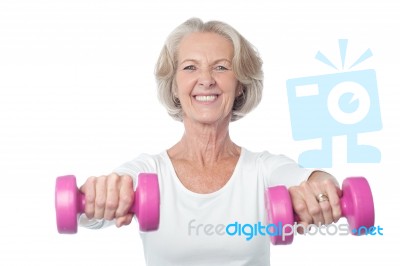 Happy Aged Woman Exercising Stock Photo