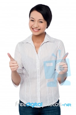 Happy Beautiful Girl Giving Two Thumbs Up Stock Photo