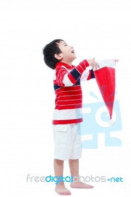 Happy Boy Hold Santa Hat  On White Background Stock Photo