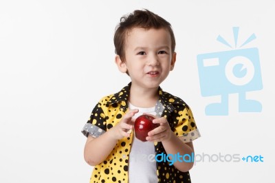 Happy Boy With A Red Apple Stock Photo