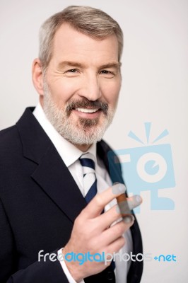 Happy Businessman With Cigar Stock Photo