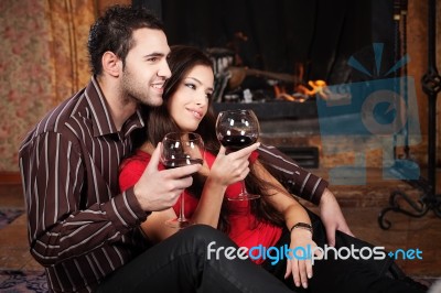 Happy Couple Near Fireplace Stock Photo