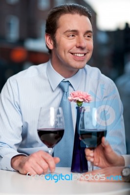 Happy Couple Toasting Red Wine Stock Photo