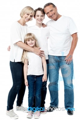 Happy Couple With Cheerful Children Stock Photo