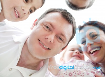 Happy Family From Down View Stock Photo