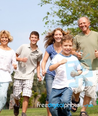 Happy Family In Playful Mood Stock Photo
