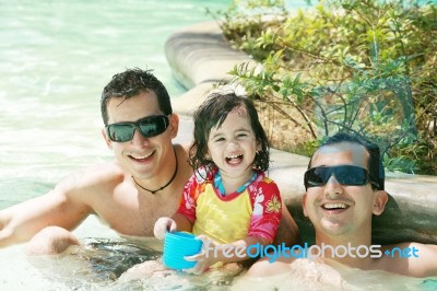 Happy Family In Swimming Pool Stock Photo