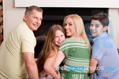 Happy Family Of Four Stock Photo