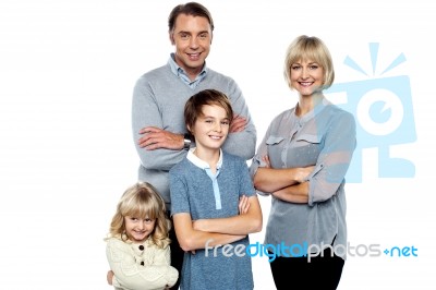 Happy Family Posing With Arms Crossed Stock Photo