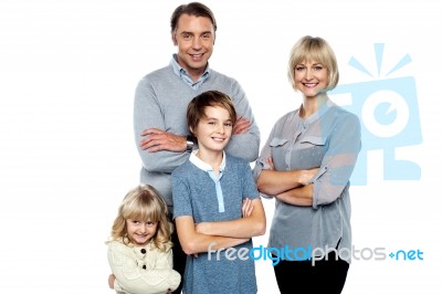 Happy Family Posing With Arms Crossed Stock Photo