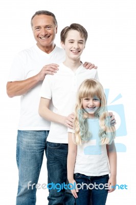 Happy Father With Children Standing In Row Stock Photo