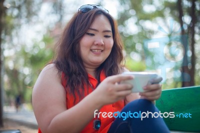 Happy Woman Using Mobile Phone Stock Photo