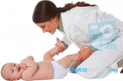 Happy Female Pediatrician Playing With Baby Boy Stock Photo