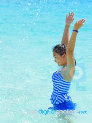 Happy Girl In The Sea Stock Photo