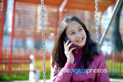 Happy Girl With Phone Stock Photo