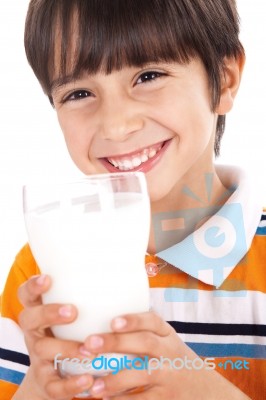 Happy Kid Drinking Glass Of Milk Stock Photo