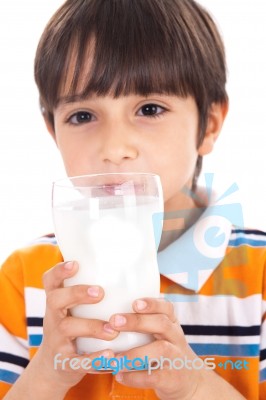 Happy Kid Drinking Glass Of Milk Stock Photo