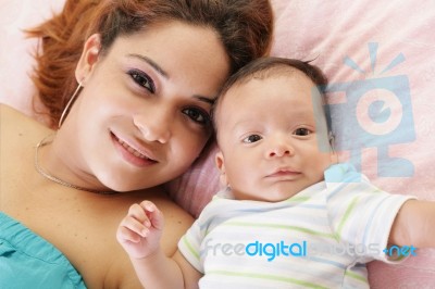 Happy Latin Mother With Her Baby Stock Photo