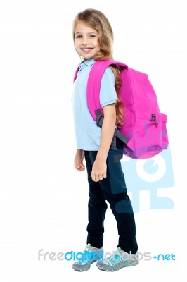 Happy Little Girl Carrying School Bag Stock Photo