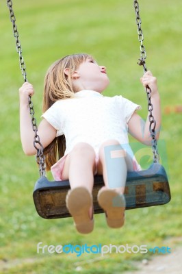 Happy Little Girl Having Fun In The Park Stock Photo