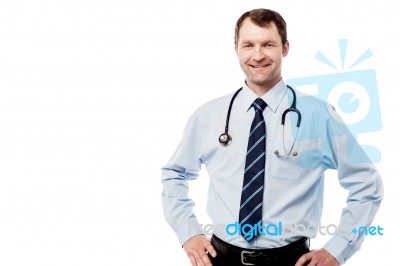 Happy Male Doctor Hold Hands On Hips Stock Photo