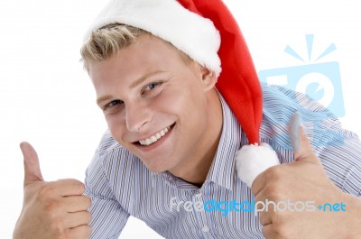 Happy Man With Christmas Hat Wishing Good Luck Stock Photo