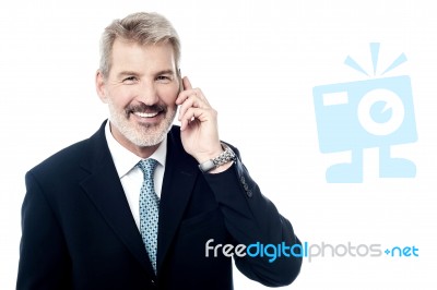 Happy Mature Man Talking On Cell Phone Stock Photo