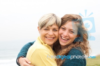 Happy Mother And Daughter Looking At Camera Stock Photo