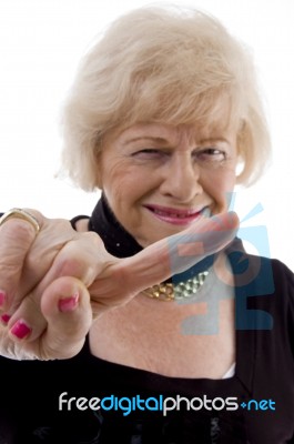 Happy Old Female Showing Finger Stock Photo