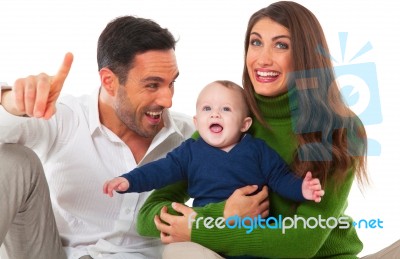 Happy Parents Playing With Son Stock Photo