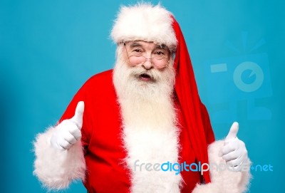 Happy Santa Claus Gesturing Thumbsup Stock Photo