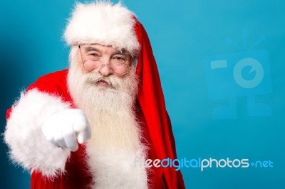 Happy Santa Claus Pointing At You Stock Photo