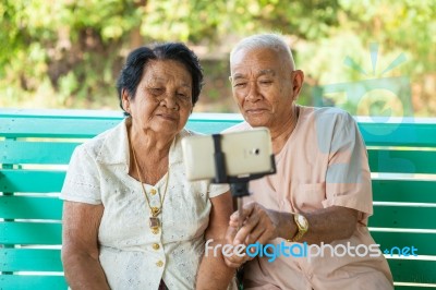 Happy Senior Couple Posing For A Selfie Stock Photo