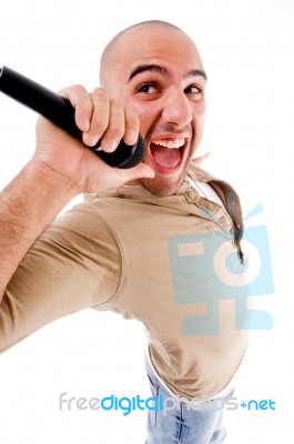 Happy Singer Singing Into Microphone Stock Photo