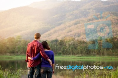 Happy Smiling Romantic Couple Relaxing In Love At The Autumn Bea… Stock Photo