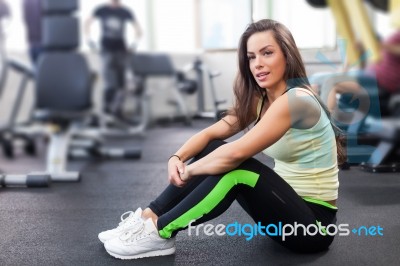Happy Woman Having A Break From Exercising In Health Club Stock Photo