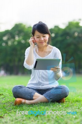 Happy Woman Holding Digital Tablet Stock Photo