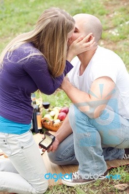 Happy Woman Kissing Her Boyfriend For The Precious Gift Stock Photo