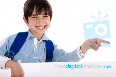 Happy Young Boy Pointing To Copy Sapce Stock Photo