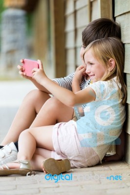 Happy Young Brothers Taking Selfies With Her Smartphone In The P… Stock Photo