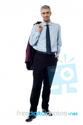 Happy Young Bussiness Man With Coat On Shoulder Stock Photo