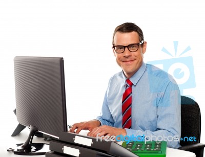 Happy Young Corporate Man Using Computer Stock Photo