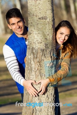 Happy Young Couple  In Love Having Fun At The Park Stock Photo