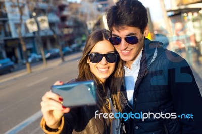Happy Young Couple Taking Selfies With Smartphone Stock Photo