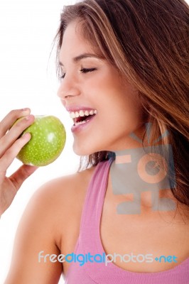 Happy Young Girl Ready To Bite A Green Apple Stock Photo