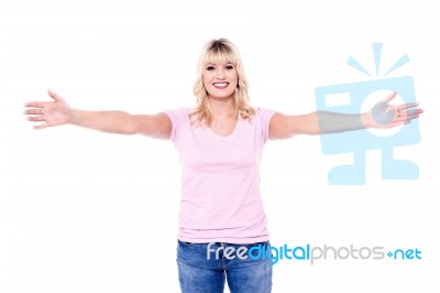 Happy Young Woman With Arms Open Stock Photo