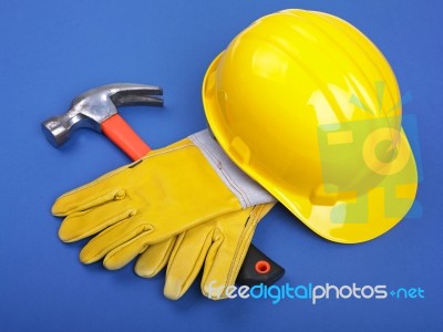 Hard Hat Hammer And Leather Gloves Stock Photo
