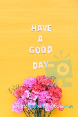 Have A Good Day  Wooden Word  With Fresh Flowers Carnations On B… Stock Photo