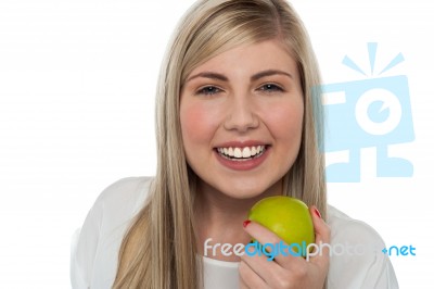 Health Conscious Girl Holding Green Apple Stock Photo